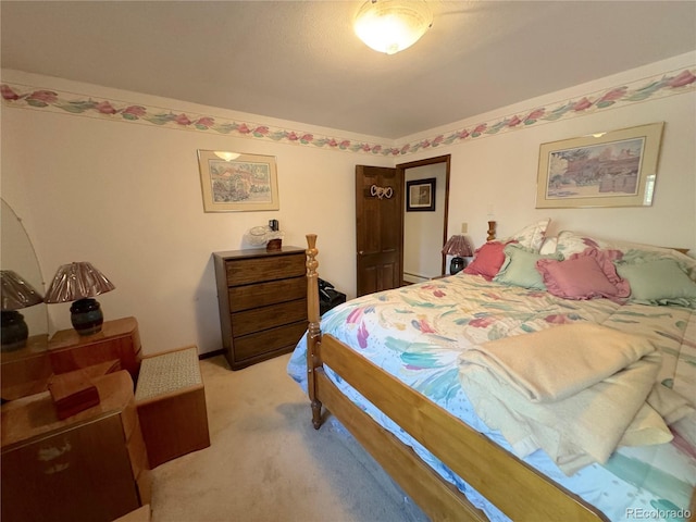 bedroom featuring light colored carpet