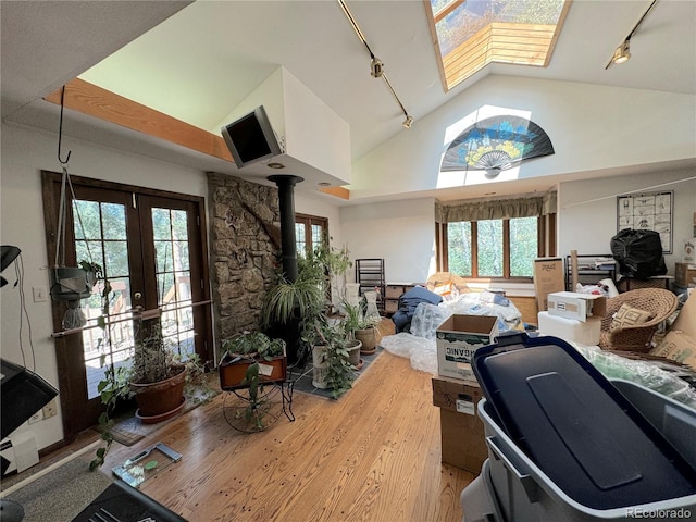 office with french doors, wood-type flooring, rail lighting, and a wealth of natural light