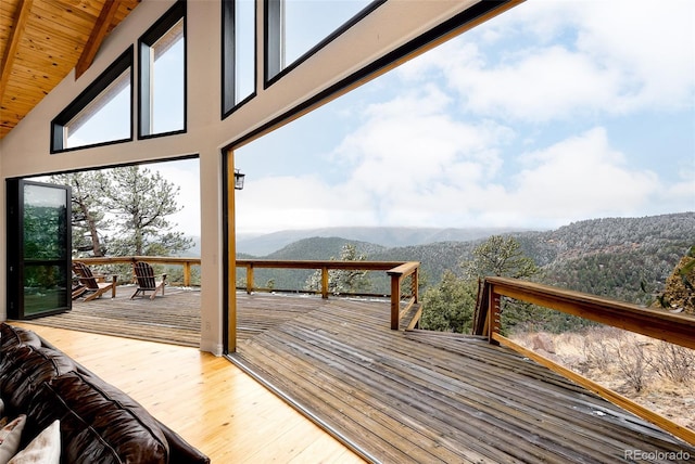 wooden terrace featuring a mountain view