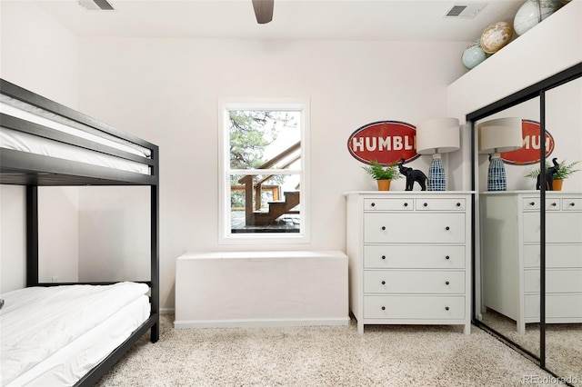 bedroom featuring ceiling fan and a closet