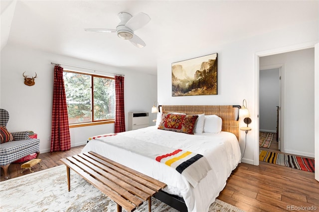 bedroom with ceiling fan and light hardwood / wood-style flooring