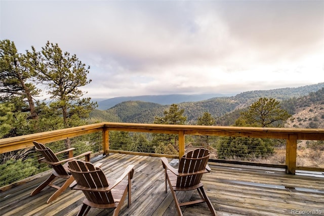 wooden deck featuring a mountain view