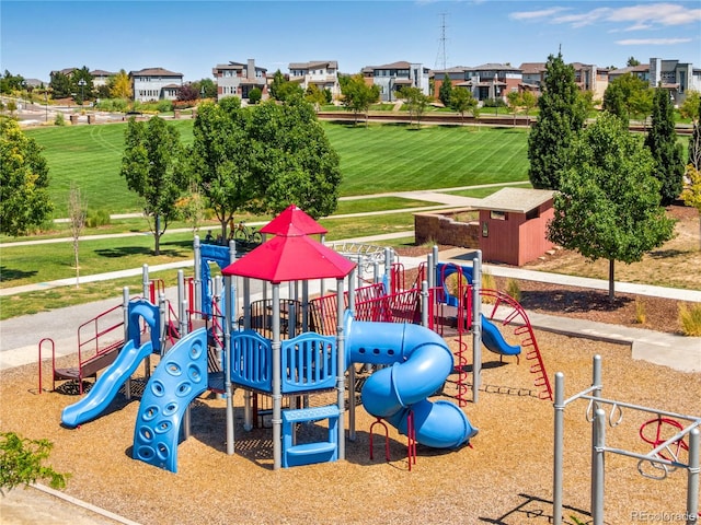 community jungle gym with a residential view