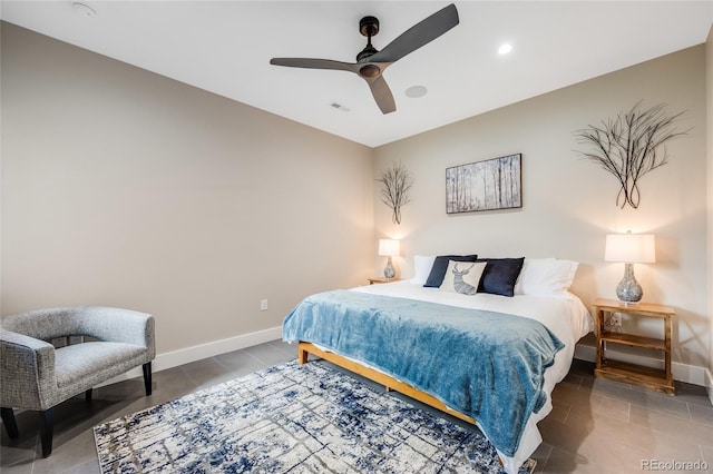 bedroom with visible vents, baseboards, ceiling fan, and tile patterned floors