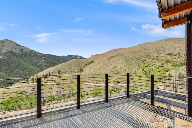 wooden terrace featuring a mountain view