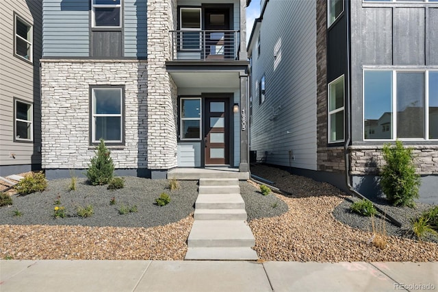 16605 Peak St, Broomfield, CO 80023 - entrance to property with stone siding and a balcony