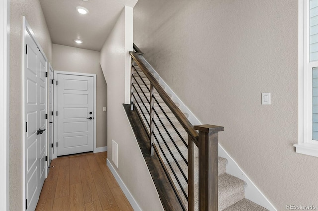16605 Peak St, Broomfield, CO 80023 - stairway featuring wood finished floors and recessed lighting