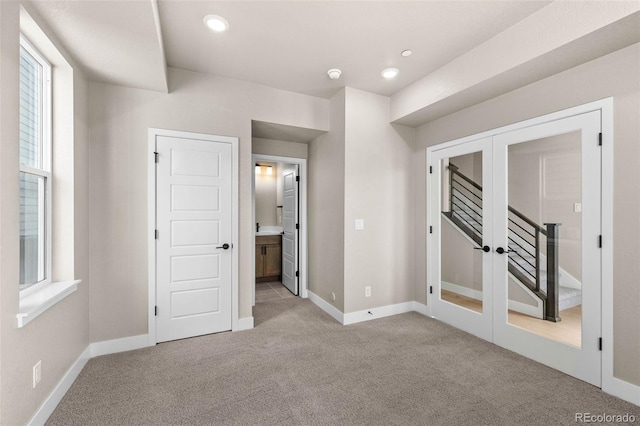 16605 Peak St, Broomfield, CO 80023 - unfurnished bedroom with french doors, light carpet, ensuite bathroom, and recessed lighting