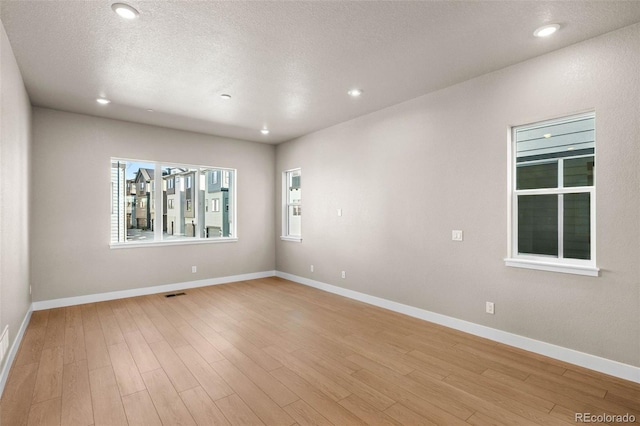 16605 Peak St, Broomfield, CO 80023 - empty room with light wood-style floors and recessed lighting