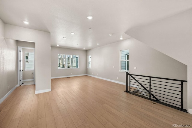 16605 Peak St, Broomfield, CO 80023 - unfurnished living room featuring recessed lighting and light wood-style flooring