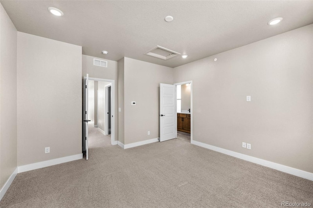 16605 Peak St, Broomfield, CO 80023 - unfurnished bedroom with light carpet, attic access, recessed lighting, and ensuite bathroom