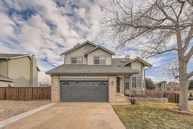 view of front property with a garage and a front yard