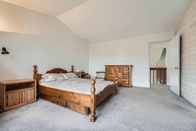 carpeted bedroom with vaulted ceiling