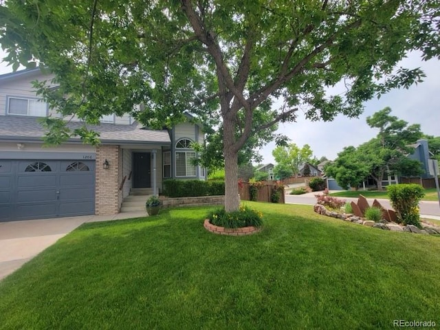 view of front facade featuring a front yard and a garage