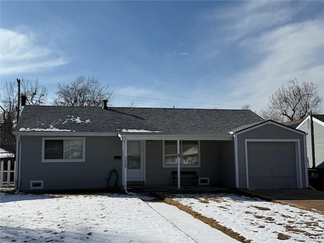 single story home featuring a garage