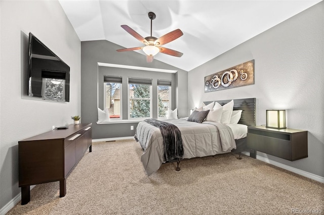 carpeted bedroom featuring ceiling fan and vaulted ceiling