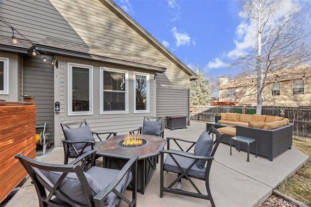 view of patio / terrace featuring an outdoor living space with a fire pit