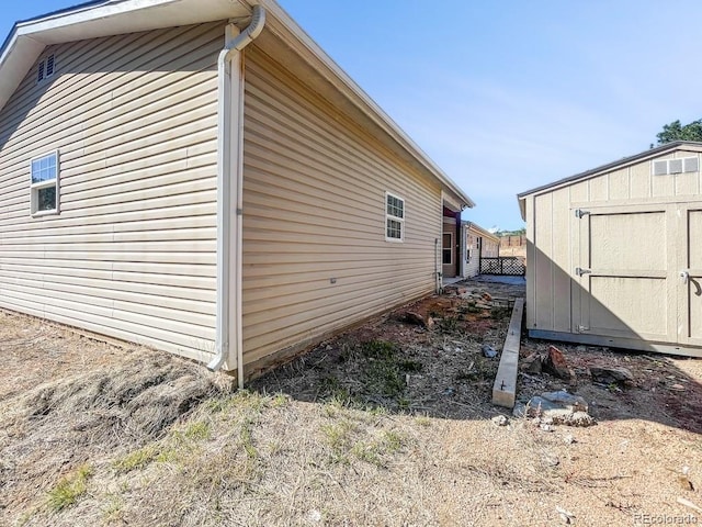 view of home's exterior featuring a shed