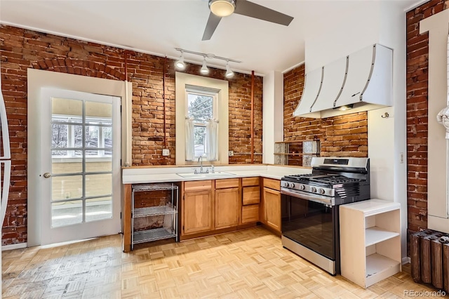 2122 E 13th Ave, Denver, CO 80206 - kitchen with wine cooler, light countertops, extractor fan, a sink, and stainless steel gas range