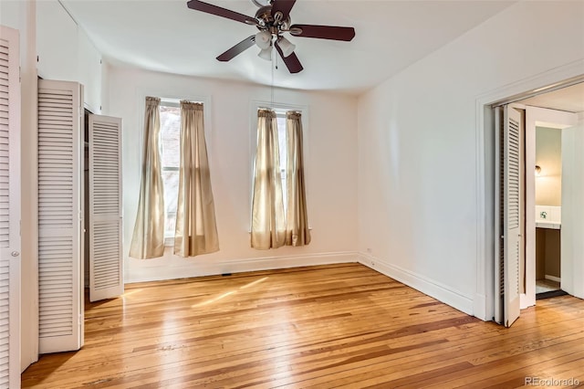 2122 E 13th Ave, Denver, CO 80206 - unfurnished bedroom featuring baseboards, a ceiling fan, and light wood-style floors