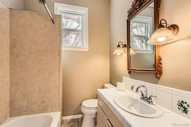 2122 E 13th Ave, Denver, CO 80206 - full bath with tile patterned floors, shower / bath combination, vanity, and toilet