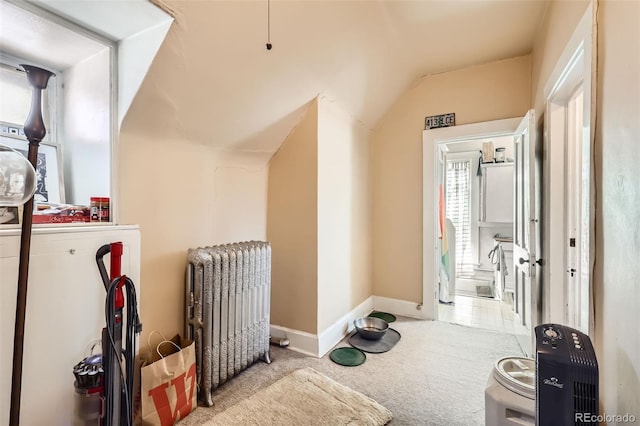 2122 E 13th Ave, Denver, CO 80206 - interior space with baseboards, vaulted ceiling, carpet flooring, and radiator
