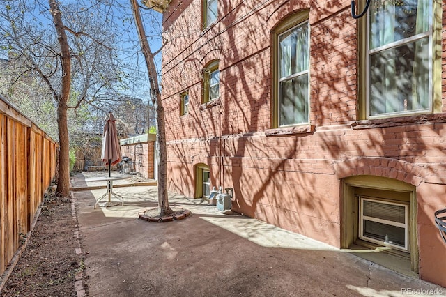 2122 E 13th Ave, Denver, CO 80206 - view of home's exterior with a fenced backyard and a patio