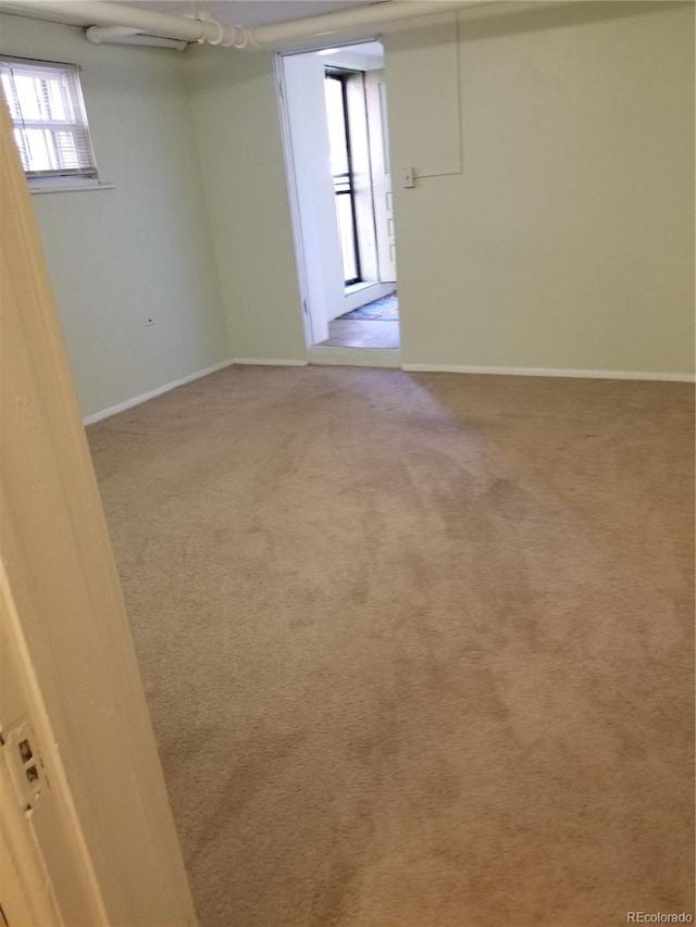 2122 E 13th Ave, Denver, CO 80206 - empty room featuring light colored carpet and baseboards