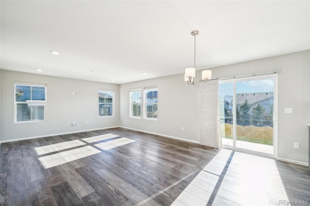 interior space featuring dark hardwood / wood-style flooring and a chandelier