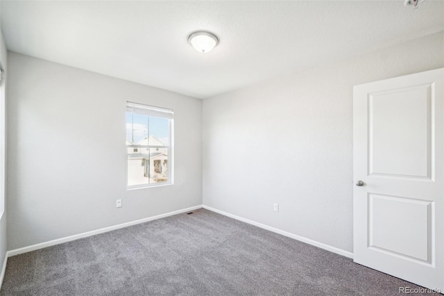 unfurnished room with carpet flooring