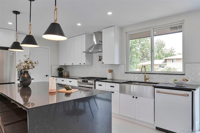 7684 S Ingalls St, Littleton, CO 80128 - kitchen with gas stove, wall chimney exhaust hood, dishwasher, tasteful backsplash, and white cabinetry