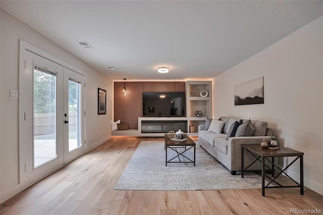 7684 S Ingalls St, Littleton, CO 80128 - living room with french doors and wood finished floors