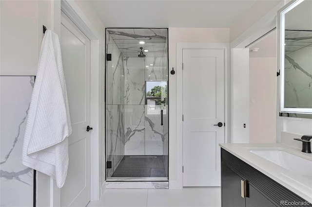7684 S Ingalls St, Littleton, CO 80128 - full bathroom featuring a marble finish shower and vanity