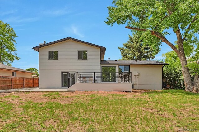 7684 S Ingalls St, Littleton, CO 80128 - back of house with a patio area