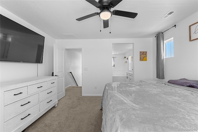 carpeted bedroom featuring ensuite bathroom and ceiling fan