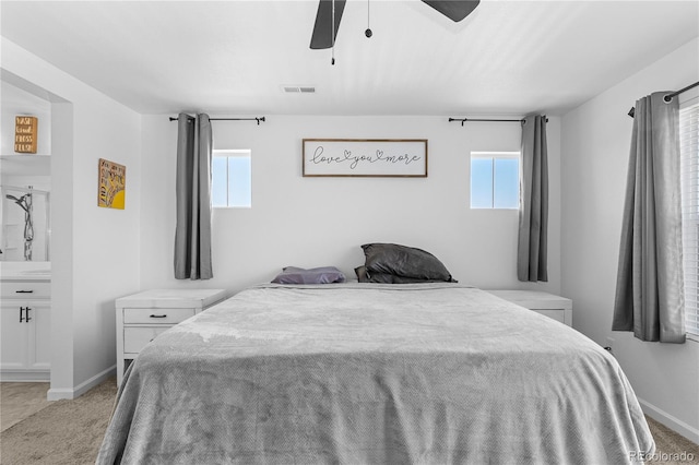 bedroom featuring ceiling fan and light carpet