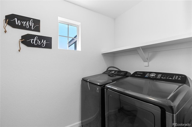 clothes washing area with washing machine and clothes dryer