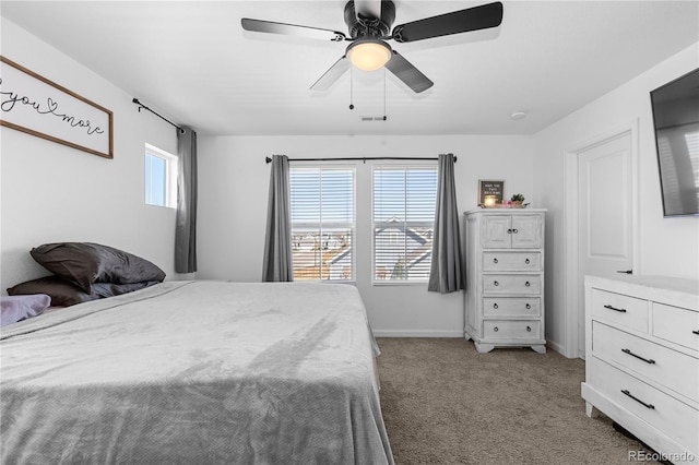 carpeted bedroom featuring ceiling fan