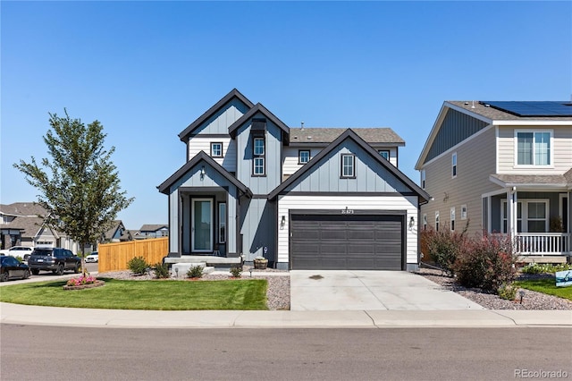 craftsman house featuring a front lawn and a garage