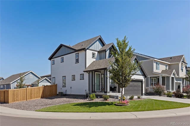 craftsman-style home featuring central AC, a front yard, and a garage