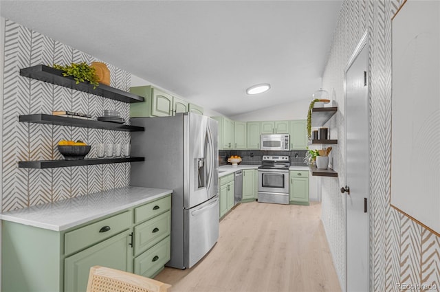 kitchen featuring light wood-style flooring, open shelves, appliances with stainless steel finishes, light countertops, and green cabinetry