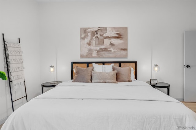 bedroom with wood finished floors