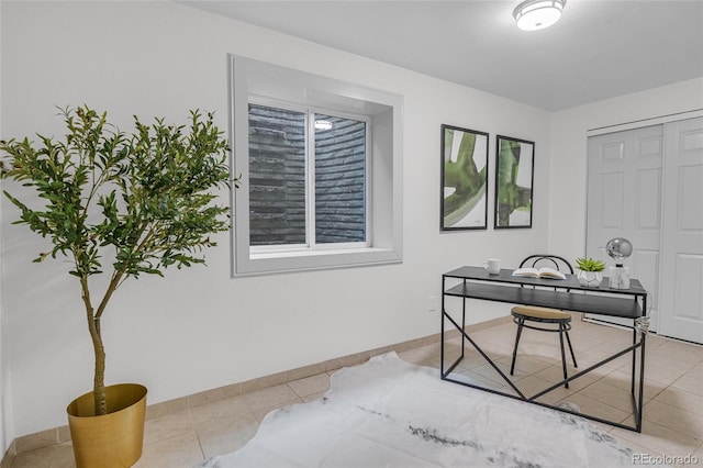 office area with tile patterned floors and baseboards