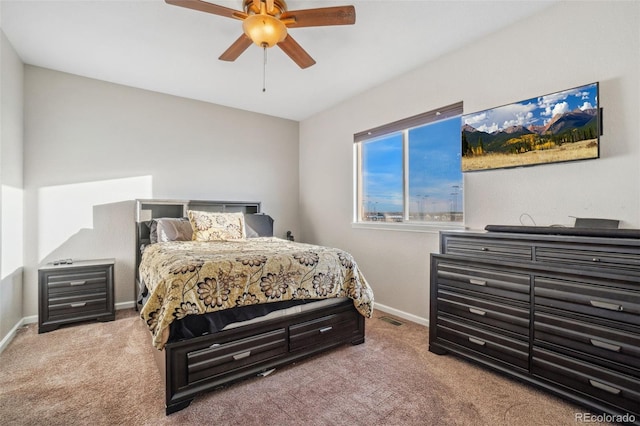 bedroom with ceiling fan and carpet flooring