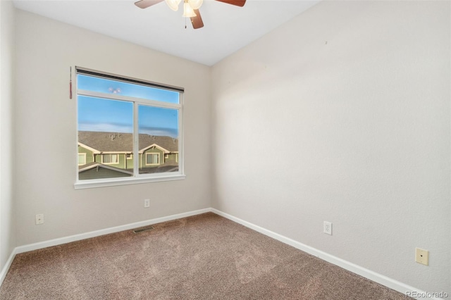 unfurnished room featuring ceiling fan and carpet floors