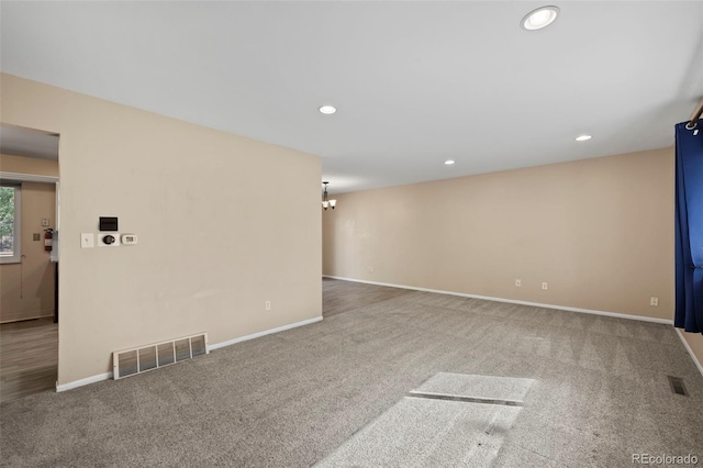 unfurnished living room featuring carpet