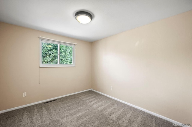 spare room featuring carpet