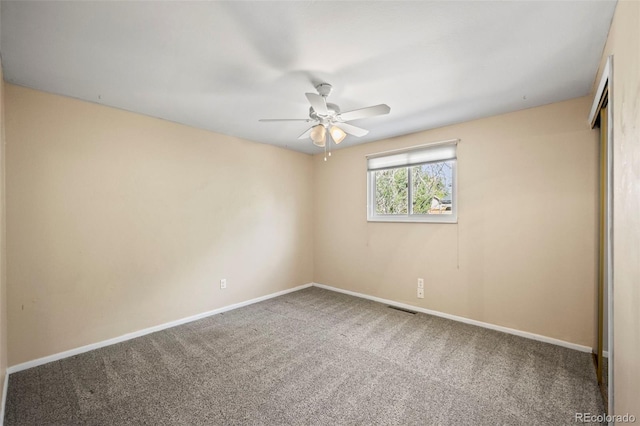 unfurnished room featuring carpet flooring and ceiling fan