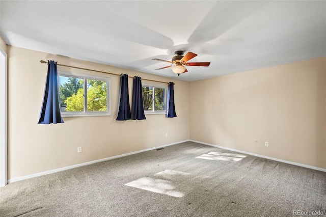 empty room with carpet and ceiling fan