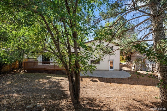 exterior space featuring a deck and a patio area